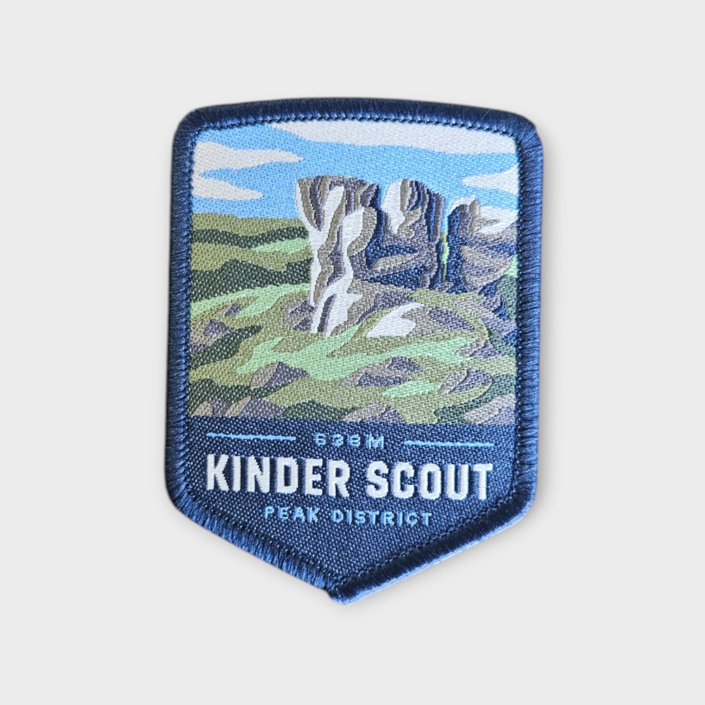 kinder scout patch on a grey background