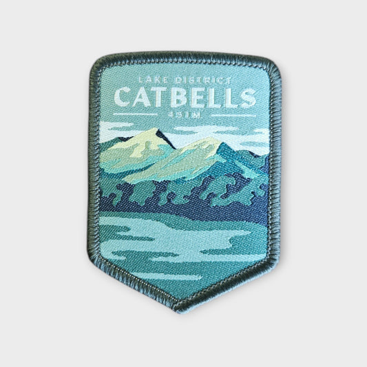 Catbells depicted in a hiking patch on a grey background