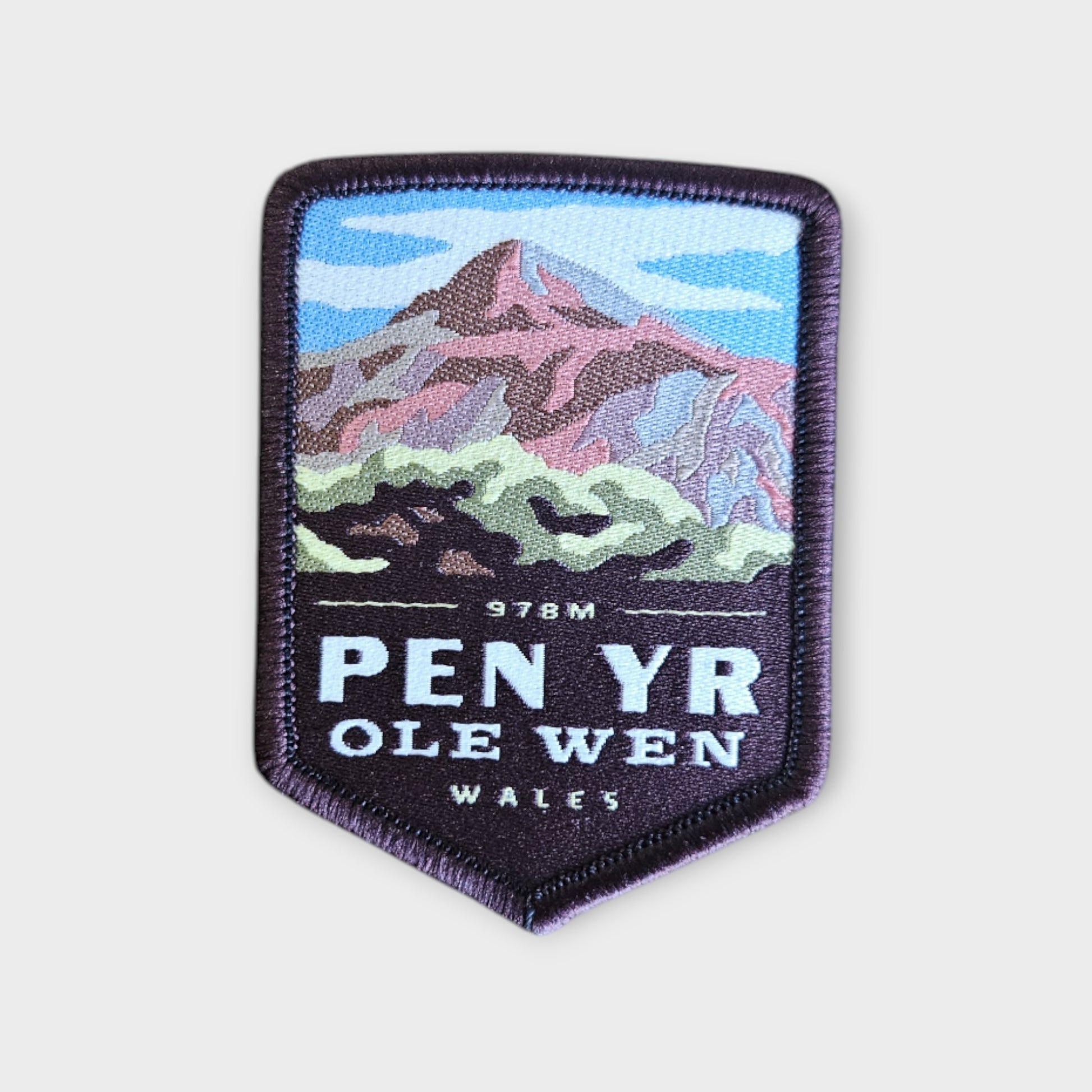 Pen yr Ole Wen depicted on a hiking patch