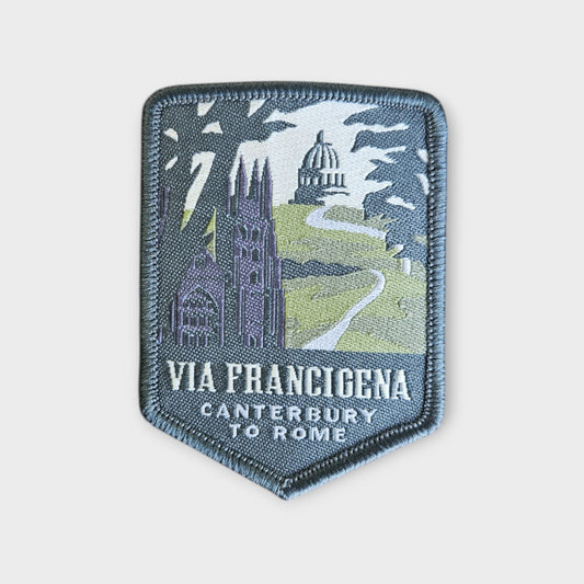 Via Francigena depicted on a hiking patch on a grey background