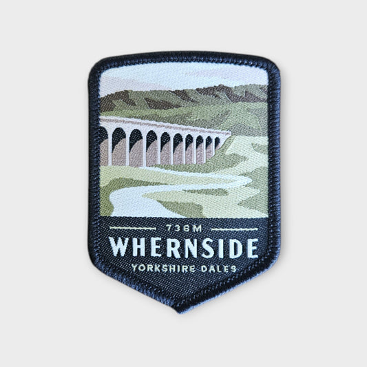 Whernside depicted on a hiking patch with a grey background
